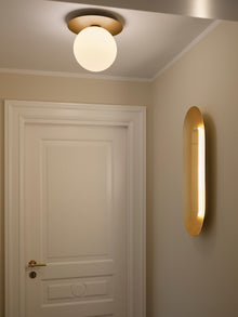 Nuura Sasi Large Vegglampe til gang i messing