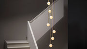 Mezzo Cluster Round pendel fra CTO Lighting med opalglasskjermer i ulike høyder