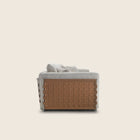 Flexform Cestone sofa, sett fra siden med flettet lærpanel