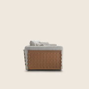 Flexform Cestone sofa, sett fra siden med flettet lærpanel