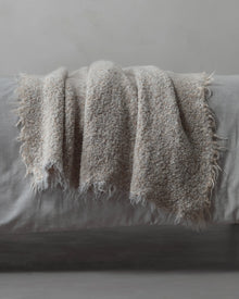 designpledd i alpakka til sofa